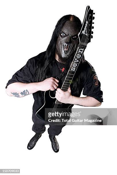 This image has been digitally manipulated) Guitarist Mick Thomson of American heavy metal group Slipknot posing with his Ibanez MTM1 Mick Thomson...