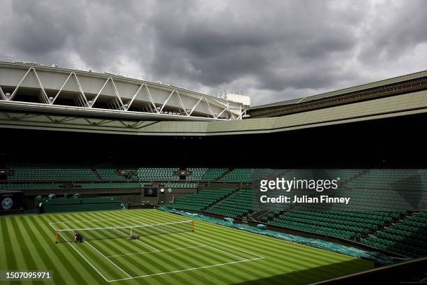 The net on Centre Court is adjusted ahead of The Championships - Wimbledon 2023 at All England Lawn Tennis and Croquet Club on July 01, 2023 in...
