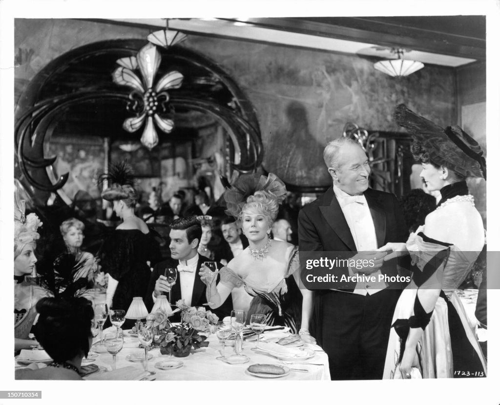 Louis Jourdan Eva Gabor And Maurice Chevalier In Packed Dining Room louis-jourdan-eva-gabor-and-maurice-chevalier-in-packed-dining-room