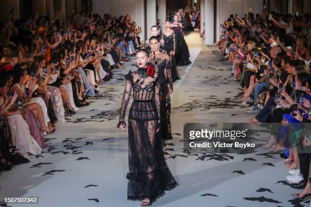 Models walk the runway during the finale of the Zuhair Murad Haute Couture Fall/Winter 2023/2024 show as part of Paris Fashion Week on July 5, 2023...