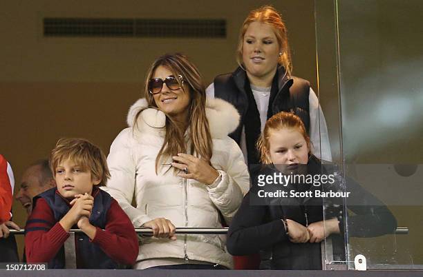 Elizabeth Hurley and her son Damian Hurley along with Brooke Warne and Summer Warne watch as Shane Warne plays a game of Aussie Rules football as he...