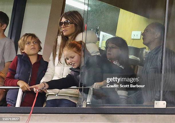 Elizabeth Hurley and her son Damian Hurley along with Summer Warne and Keith Warne watch as Shane Warne plays a game of Aussie Rules football as he...