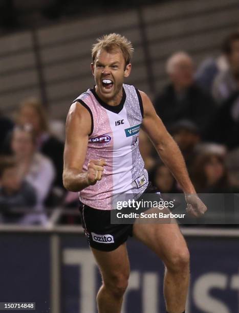 Beau Wilkes of the Saints celebrates after kicking a goal during the round 22 AFL match between the St Kilda Saints and the Greater Western Sydney...