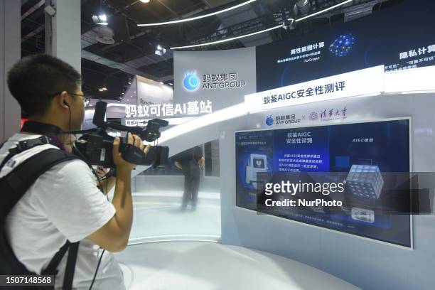 Media photographer is taking a photo of Ant Group's generative artificial Intelligence AIGC solution at the 2023 World Artificial Intelligence...