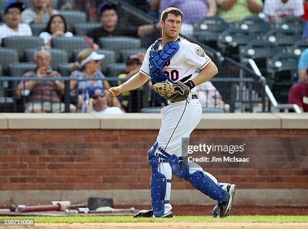 Josh Thole of the New York Mets in action against the Colorado Rockies at Citi Field on August 23, 2012 in the Flushing neighborhood of the Queens...