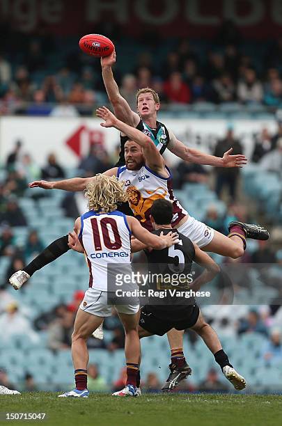 Matthew Lobbe of the Power contests the ruck with Ben Hudson of the Lions during the round 22 AFL match between the Port Adelaide Power and the...