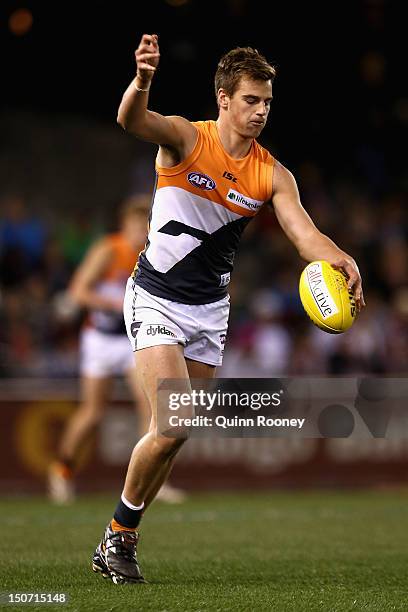 Dom Tyson of the Giants kicks during the round 22 AFL match between the St Kilda Saints and the Greater Western Sydney Giants at Etihad Stadium on...