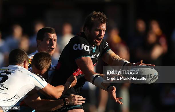 Clint Newton of the Panthers offloads in the tackle during the round 25 NRL match between the Penrith Panthers and the Gold Coast Titans at Centrebet...