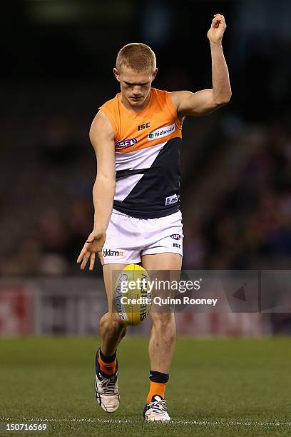 Adam Treloar of the Giants kicks during the round 22 AFL match between the St Kilda Saints and the Greater Western Sydney Giants at Etihad Stadium on...