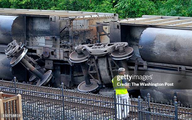Coal cars from the eastbound 80-car CSX train that flipped off the tracks on Tuesday, August 21, 2012 in Ellicott City, MD.