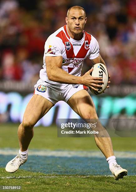 Matt Cooper of the Dragons runs the ball during the round 25 NRL match between the St George Dragons and the New Zealand Warriors at WIN Stadium on...