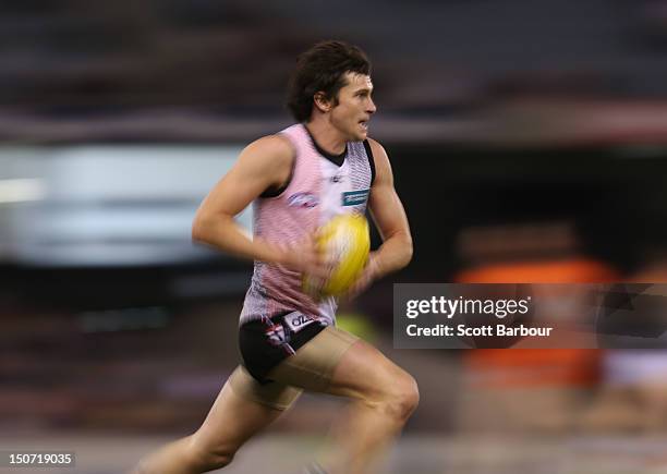 Farren Ray of the Saints runs with the ball during the round 22 AFL match between the St Kilda Saints and the Greater Western Sydney Giants at Etihad...