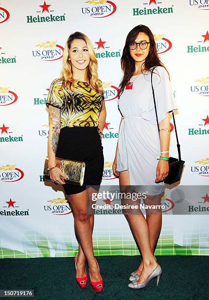 Bravo TV Personalities Liz Margulies and Claudia Martinez Reardon attend the Heineken 2012 US Open Player Party at the Gansevoort Park Hotel on...