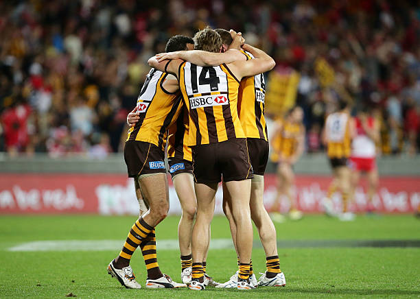 Hawks players celebrate at fulltime during the round 22 AFL match between the Sydney Swans and the Hawthorn Hawks at Sydney Cricket Ground on August...