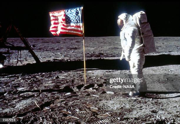 Astronaut Edwin "Buzz" Aldrin poses next to the U.S. Flag July 20, 1969 on the moon during the Apollo 11 mission.
