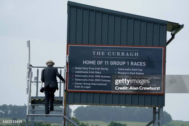 An official makes his way to th stewards viewing box at Curragh Racecourse on July 01, 2023 in Kildare, Ireland.