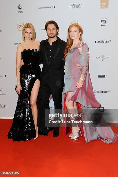 Eva Padberg, Simon Verhoeven and Barbara Meier attend the Red Carpet for the Bambi Award 2011 ceremony at the Rhein-Main-Hallen on November 10, 2011...