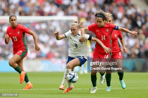 Georgia Stanway of England battles for possession with Dolores Silva of Portugal during the Women's International Friendly match between England and...