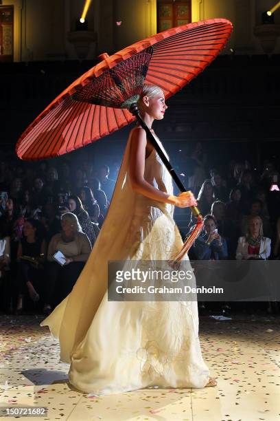 Model showcases designs by Akira on the catwalk as part of Mercedes Benz Fashion Festival Sydney 2012 at Sydney Town Hall on August 25, 2012 in...