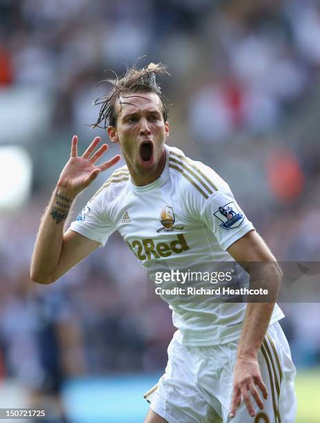 Michu of Swansea celebrates scoring the second goal during the Barclays Premier League match between Swansea City and West Ham United at the Liberty...