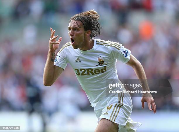 Michu of Swansea celebrates scoring the second goal during the Barclays Premier League match between Swansea City and West Ham United at the Liberty...