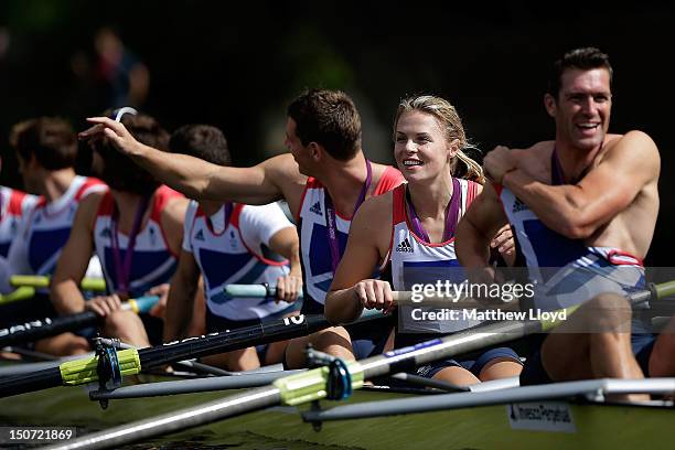 Olympic gold medallist Anna Watkins from the Leander club perform a celebratory row past crowds on August 25, 2012 in Henley-on-Thames, England....