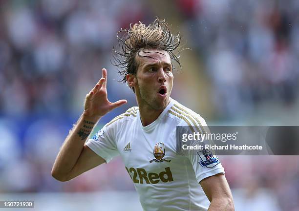 Michu of Swansea celebrates scoring the second goal during the Barclays Premier League match between Swansea City and West Ham United at the Liberty...