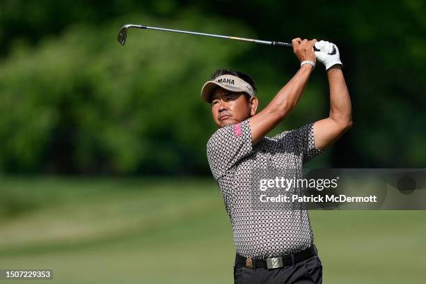 Hiroyuki Fujita of Japan plays from the fairway on the first hole during the third round of the U.S. Senior Open Championship at SentryWorld on July...