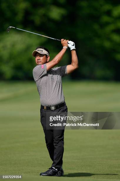 Hiroyuki Fujita of Japan plays from the fairway on the first hole during the third round of the U.S. Senior Open Championship at SentryWorld on July...