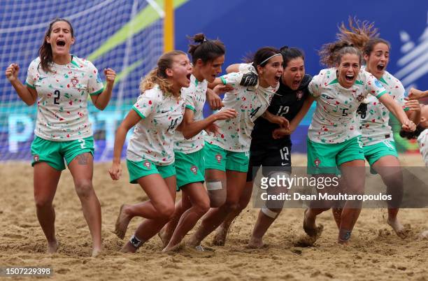 Players of Portugal celebrate victory in the Penalty Shoot out after the Beach Soccer - Women's Bronze Medal Match on Day Twelve of the European...