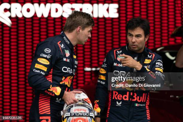 Max Verstappen of Netherlands and Red Bull Racing talk with Sergio Perez of Mexico and Red Bull Racing during the Sprint ahead of the F1 Grand Prix...