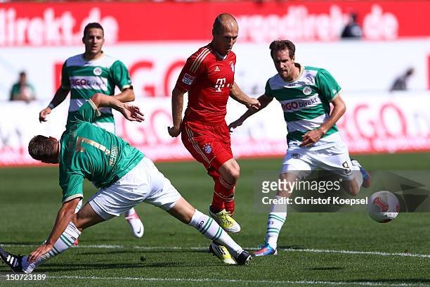 Bernd Nehrig of Fuerth and Stephan Fierstner of Fuerth challenges Arjen Robben of Bayern during the Bundesliga match between Greuther Fuerth and FC...