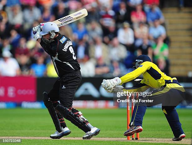 Somerset batsman Marcus Trescothick is bowled by Dimitri Mascarenhas during the Friends Life T20 Semi Final between Hampshire and Somerset at SWALEC...