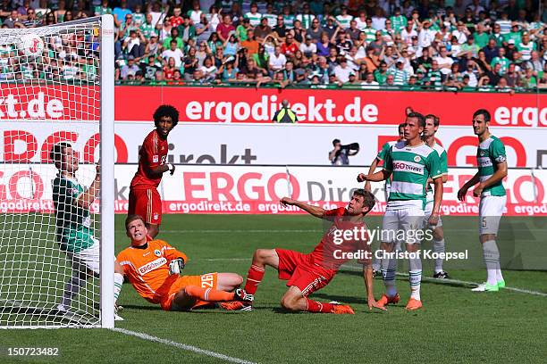 Thomas Muelle rof Bayern scores the first goal against Max Gruen of Fuerth during the Bundesliga match between Greuther Fuerth and FC Bayern Muenchen...