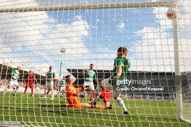 Max Gruen of Fuerth and Heinrich Schmidtgal get the first goal of Thomas Mueller of Bayern during the Bundesliga match between Greuther Fuerth and FC...