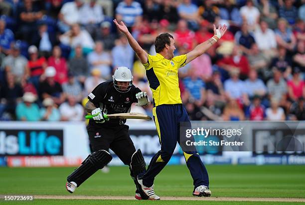 Somerset batsman Peter Trego crashes into Hampshire bowler Sean Ervine who had just trapped him lbw during the Friends Life T20 Semi Final between...