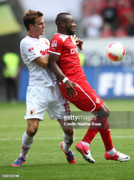 Sebastian Langkamp of FCA and Nando Rafael of Fortuna compete for the ball during the Bundesliga match between FC Augsburg v Fortuna Duesseldorf 1895...