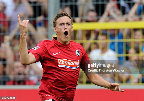 Max Kruse of Freiburg celebrates after scoring his teams first goal during the Bundesliga match between SC Freiburg and FSV Mainz 05 at Mage Solar...