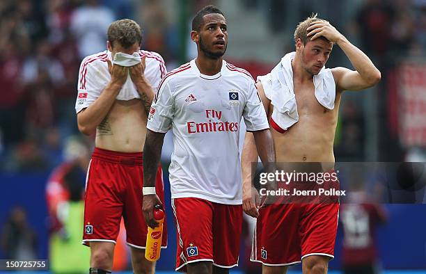 Player of Hamburg are seen disappointed after the Bundesliga match between Hamburger SV and 1. FC Nuernberg at Imtech Arena on August 25, 2012 in...