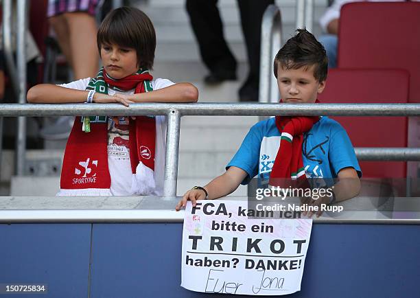 FYoung fans look on prior to the Bundesliga match between FC Augsburg and Fortuna Duesseldorf 1895 at SGL Arena on August 25, 2012 in Augsburg,...