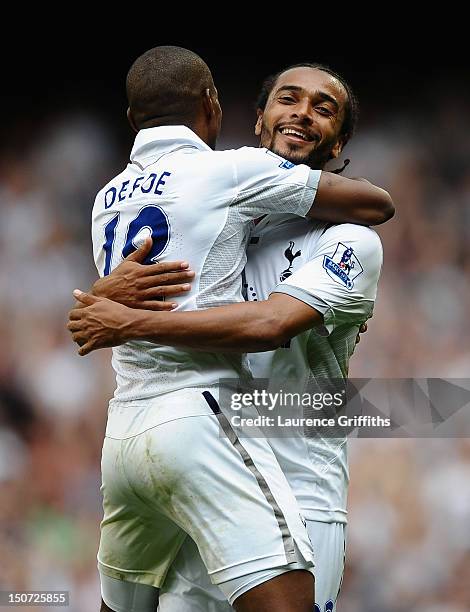 Benoit Assou-Ekotto of Tottenham Hotspur celebrates his goal with Jermain Defoe during the Barclays Premier League match between Tottenham Hotspur...