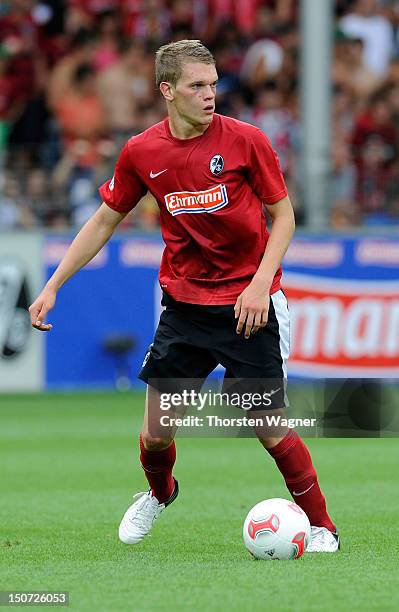 Matthias Ginter of Freiburg runs with the ball during the Bundesliga match between SC Freiburg and FSV Mainz 05 at Mage Solar stadium on August 25,...