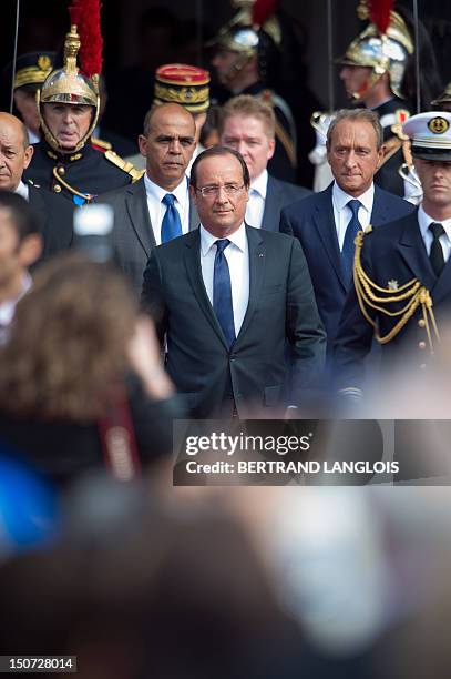 French president Francois Hollande , French Defence Minister Jean-Yves Le Drian , French Junior Minister for Veterans, Kader Arif and Paris' mayor...