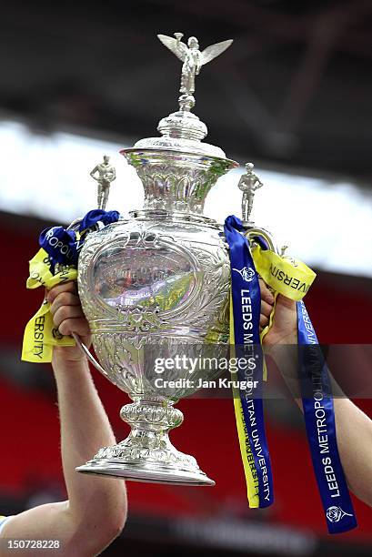 Wolves players celebrate with the trophy during the Carnegie Challenge Cup Final between Leeds Rhinos and Warrington Wolves at Wembley Stadium on...
