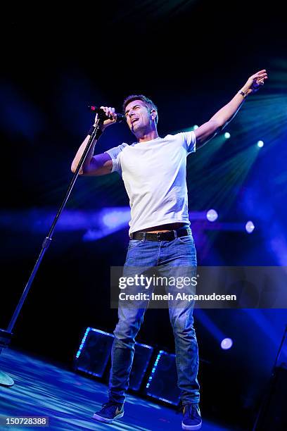 Vocalist/guitarist Nick Hexum of 311 performs onstage at Verizon Wireless Amphitheatre on August 24, 2012 in Laguna Hills, California.