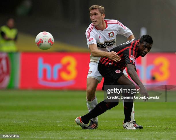 Stefan Reinartz of Leverkusen and Olivier Occean of Frankfurt battle for the ball during the Bundesliga match between Eintracht Frankfurt and Bayer...