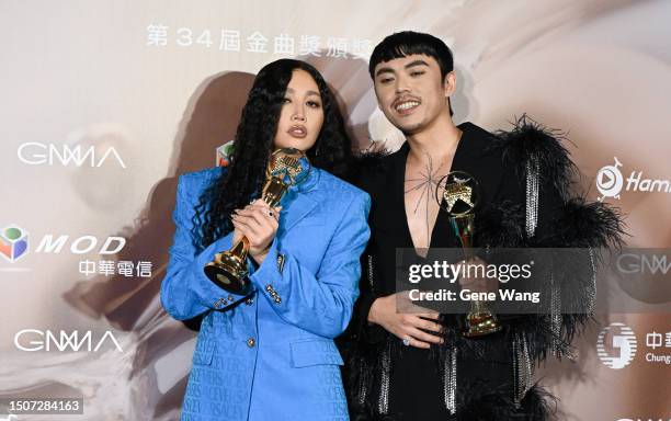 Lin , Hush pose with the award for Best Male and Female Singer in the press room during the 34th Golden Melody Awards Ceremony at Taipei Arena on...