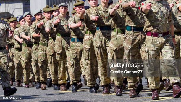 military personnel parading on union street, aberdeen during armed forces day, 2023 - british veterans stock pictures, royalty-free photos & images