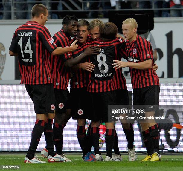 Stefan Aigner of Frankfurt celebrates with teammates after scoring his team's second goal during the Bundesliga match between Eintracht Frankfurt and...