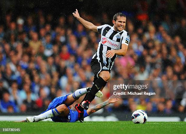 Yohan Cabaye of Newcastle United evades Raul Meireles of Chelsea during the Barclays Premier League match between Chelsea and Newcastle United at...